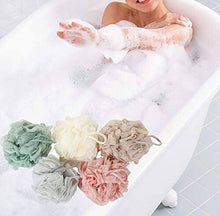 Load image into Gallery viewer, Woman enjoying a relaxing bath with colorful exfoliating loofah sponges in a bubble-filled tub.