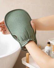 Load image into Gallery viewer, Exfoliating loofah glove in green color being held, designed for smooth skin and effortless exfoliation.