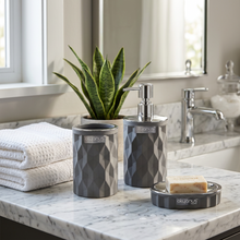 Load image into Gallery viewer, A three-piece bathroom accessory set including a liquid soap dispenser, a toothbrush and paste cup, and a dry soap dispenser, in black color with a geometric diamond pattern and silver frame.