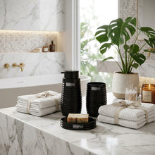 Load image into Gallery viewer, Black ribbed soap dispenser, toothbrush cup and soap dish on a marble counter