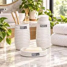 تحميل الصورة في عارض المعرض، Three-piece white bathroom set with a ribbed design, including a soap dish, cup, and pump bottle, shown with a small inset of the set styled in a bathroom environment.