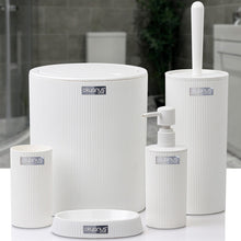 Load image into Gallery viewer, Set of white bathroom accessories including a toilet brush holder, bottle, and container on a white surface with a blurred bathroom background.