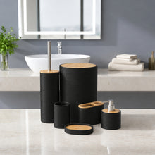 تحميل الصورة في عارض المعرض، A six-piece bathroom vanity set in textured black with light natural wood lids, arranged on a marble countertop in front of a modern sink and mirror.