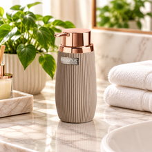 Load image into Gallery viewer, A black striped soap dispenser with a copper frame and a pump, with the brand 'Meyco' visible on the front.