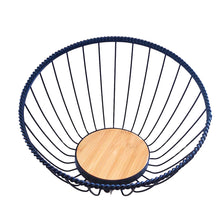 Load image into Gallery viewer, A matte black metal fruit bowl with a round bamboo base, coated iron frame, and a smooth finish.