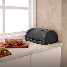 Load image into Gallery viewer, Black bread bin on a kitchen counter with sliced bread and a sandwich.