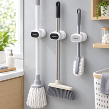 Load image into Gallery viewer, Wall-mounted holders supporting cleaning tool handles