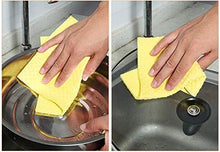 تحميل الصورة في عارض المعرض، Person cleaning a sink with a yellow cloth.