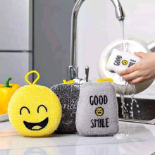 Load image into Gallery viewer, Emoji-themed cleaning sponges and a scrubber being rinsed under a faucet.