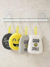 Load image into Gallery viewer, Three smiley face cleaning pads hanging on a rack.