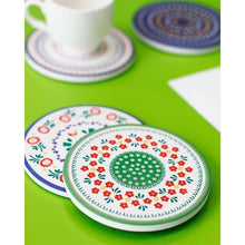 Load image into Gallery viewer, Decorative coasters with floral patterns on a green surface