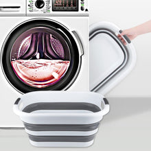 Load image into Gallery viewer, Collapsible washing basket with a washing machine in the background
