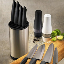 Load image into Gallery viewer, Set of knives, pepper grinder, salt shaker on a wooden cutting board with a neutral background