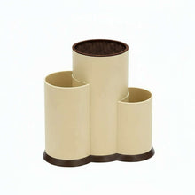 Load image into Gallery viewer, Beige and black cylindrical holder with a label on a white background