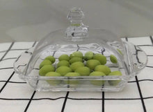 تحميل الصورة في عارض المعرض، Clear glass container with green apples on a white and black checkered background