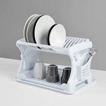 Load image into Gallery viewer, White dish rack with plates and cups on a gray background