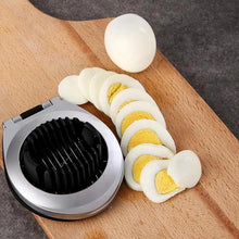 تحميل الصورة في عارض المعرض، Egg slicer with sliced hard-boiled eggs on a wooden cutting board