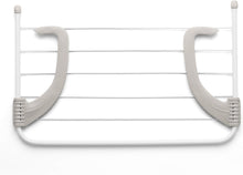 Load image into Gallery viewer, White metal rack with curved ends on a white background
