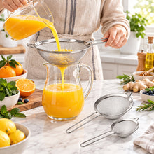تحميل الصورة في عارض المعرض، A set of three stainless steel fine mesh strainers with long wooden handles, in varying sizes, displayed alongside a visual representation of one strainer being used to strain pasta.