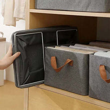 Load image into Gallery viewer, Folded storage box beside open boxes in a wardrobe