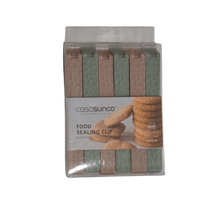 تحميل الصورة في عارض المعرض، A pack of food sealing clips in varying shades of pink and green, presented in a clear plastic packaging with a product label.