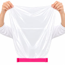 تحميل الصورة في عارض المعرض، Clear plastic bag held by hands with a pink label at the bottom.