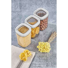 تحميل الصورة في عارض المعرض، Set of four transparent food storage containers with white lids on a gray surface.