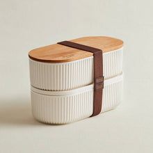 Load image into Gallery viewer, White lunch box with wooden lid and brown strap on plain background
