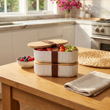 Load image into Gallery viewer, Stack of ceramic food containers with wooden lids on a woven surface.