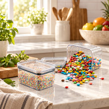 تحميل الصورة في عارض المعرض، Clear containers with colorful candies on a light blue surface