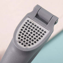 تحميل الصورة في عارض المعرض، Gray kitchen grater on a light pink background