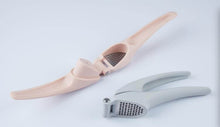 Load image into Gallery viewer, Two stainless steel garlic presses with silver and gold colored handles.
