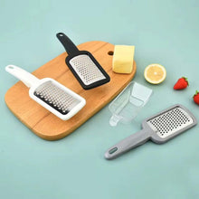 تحميل الصورة في عارض المعرض، Set of handheld graters on a wooden board with fruits and vegetables on a light blue background