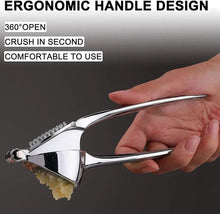 Load image into Gallery viewer, Hand using a garlic press with text highlighting ergonomic design features on a dark background