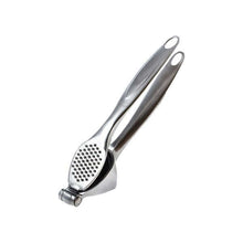 تحميل الصورة في عارض المعرض، Metallic garlic press on a white background