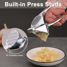 تحميل الصورة في عارض المعرض، Garlic press with built-in press studs, showing minced garlic and close-up of 54 chamber holes.