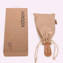 تحميل الصورة في عارض المعرض، Beige drawstring bag with wooden paddle and brown paper bag featuring 'HAODA' branding on a white background.