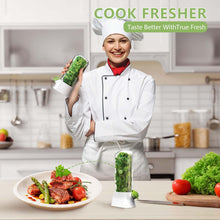 Load image into Gallery viewer, Chef holding Herb Fridge Capsule with fresh herbs in a kitchen, promoting vegetable freshness and cooking quality.