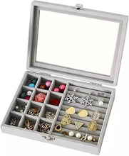 Load image into Gallery viewer, Jewelry box with compartments filled with various earrings on a white background