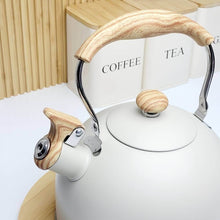 Load image into Gallery viewer, White kettle with wooden handle and spout on a white surface.