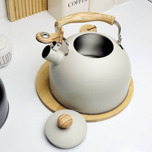 Load image into Gallery viewer, White kettle with wooden handle and lid on a white background