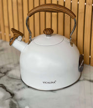 Load image into Gallery viewer, White kettle with wooden handles on a marble surface