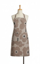Load image into Gallery viewer, Floral patterned apron on a textured surface
