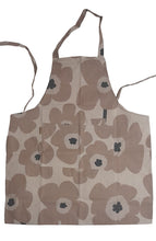 Load image into Gallery viewer, Floral patterned apron on a textured surface