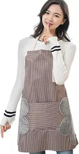 Load image into Gallery viewer, Woman wearing a striped apron with gray accents.