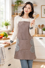 تحميل الصورة في عارض المعرض، Woman wearing a striped apron with gray accents.