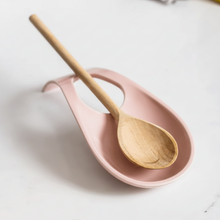 تحميل الصورة في عارض المعرض، Wooden spoon on a pink ceramic dish with a white background