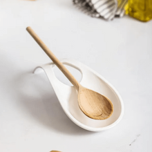 تحميل الصورة في عارض المعرض، Wooden spoon in a white dish on a light background