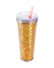 Load image into Gallery viewer, A tall clear plastic travel tumbler filled with shimmering holographic gold foil flakes, featuring a clear lid and a translucent orange straw, isolated on a white background.