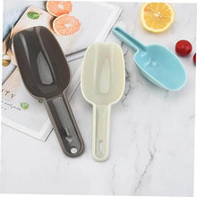 Load image into Gallery viewer, A set of two plastic shovels in black and gray colors, placed on a marble surface with a book and some fruits in the background. One shovel is larger (150 ml) and the other is smaller (50 ml).
